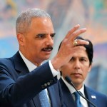 Former U.S. Attorney General Eric Holder, speaks at a news conference to discuss the proposed so-called California “sanctuary state bill” as California state Senate President pro Tempore Kevin de Leon listens, Monday, June 19, 2017, in Los Angeles. (AP Photo/Mark J. Terrill)