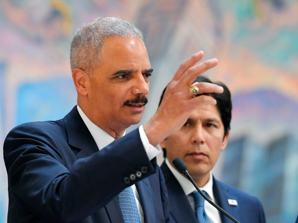 Former U.S. Attorney General Eric Holder, speaks at a news conference to discuss the proposed so-called California “sanctuary state bill” as California state Senate President pro Tempore Kevin de Leon listens, Monday, June 19, 2017, in Los Angeles. (AP Photo/Mark J. Terrill)