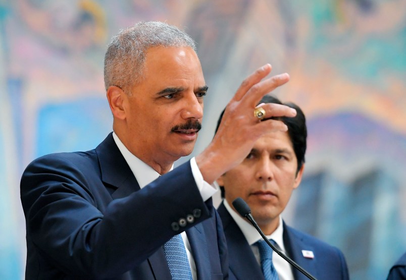 Former U.S. Attorney General Eric Holder, speaks at a news conference to discuss the proposed so-called California “sanctuary state bill” as California state Senate President pro Tempore Kevin de Leon listens, Monday, June 19, 2017, in Los Angeles. (AP Photo/Mark J. Terrill)