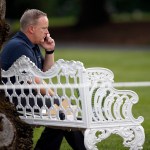 White House Press Secretary Sean Spicer talks on a phone during the Congressional Picnic on the South Lawn of the White House, Thursday, June 22, 2017, in Washington. (AP Photo/Alex Brandon)