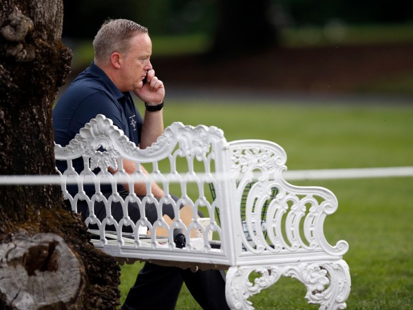 White House Press Secretary Sean Spicer talks on a phone during the Congressional Picnic on the South Lawn of the White House, Thursday, June 22, 2017, in Washington. (AP Photo/Alex Brandon)
