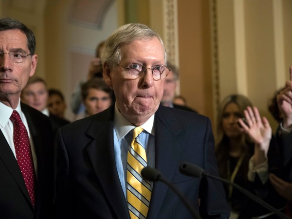 Senate Majority Leader Mitch McConnell, R-Ky., joined by Sen. John Barrasso, R-Wyo., left, tells reporters he is delaying a vote on the Republican health care bill while GOP leadership works toward getting enough votes, at the Capitol in Washington, Tuesday, June 27, 2017. In a bruising setback, Senate Republican leaders are delaying a vote on their prized health care bill until after the July 4 recess, forced to retreat by a GOP rebellion that left them lacking enough votes to even begin debating the legislation, two sources said Tuesday. (AP Photo/J. Scott Applewhite)