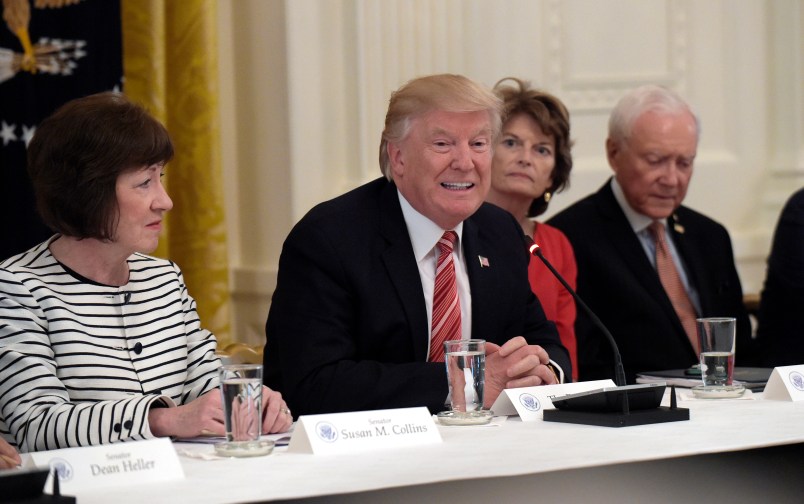 President Donald Trump, center, speaks as he meets with Republican senators on health care in the East Room of at the White House in Washington, Tuesday, June 27, 2017. Seated with him, from left, are Sen. Susan Collins, R-Maine, Sen. Lisa Murkowski, R-Alaska, and Sen. Orrin Hatch, R-Utah. (AP Photo/Susan Walsh)