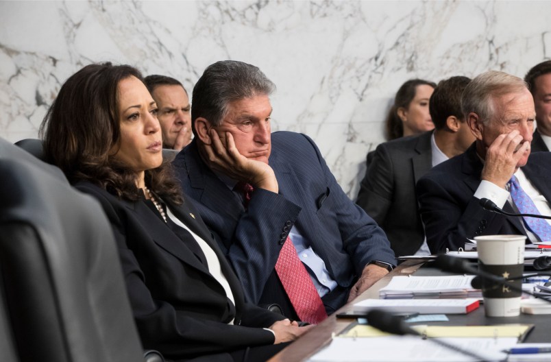 Senate Intelligence Committee members, from left, Sen. Kamala Harris, D-Calif., Sen. Joe Manchin, D-W.Va., and Sen. Angus King, D-Maine, listen to testimony from Director of National Intelligence Dan Coats and other security chiefs about gathering intelligence on foreign agents, on Capitol Hill in Washington, Wednesday, June 7, 2017. (AP Photo/J. Scott Applewhite)