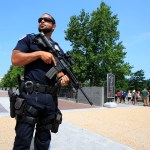 U.S. Capitol Police officer Nathan Rainey, stands guard outside the U.S. Capitol, in Washington, Wednesday, June 14, 2017, after House Majority Whip Steve Scalise of La. was shot during a congressional baseball practice. (AP Photo/Manuel Balce Ceneta)