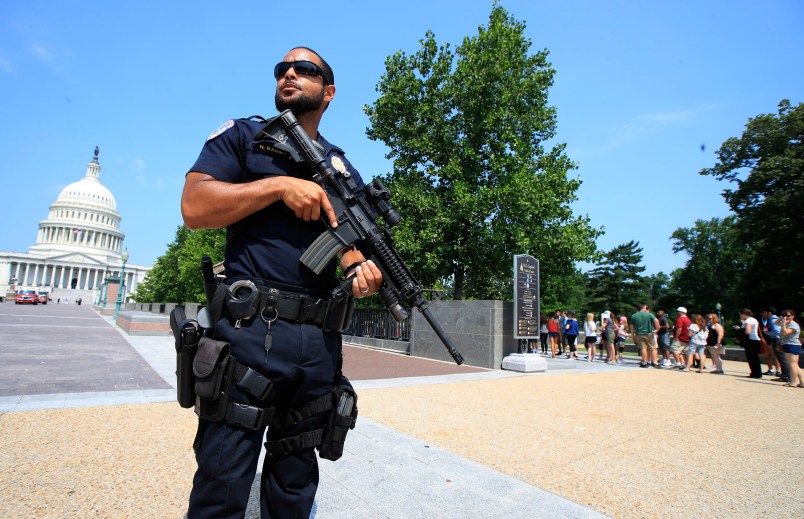 U.S. Capitol Police officer Nathan Rainey, stands guard outside the U.S. Capitol, in Washington, Wednesday, June 14, 2017, after House Majority Whip Steve Scalise of La. was shot during a congressional baseball practice. (AP Photo/Manuel Balce Ceneta)