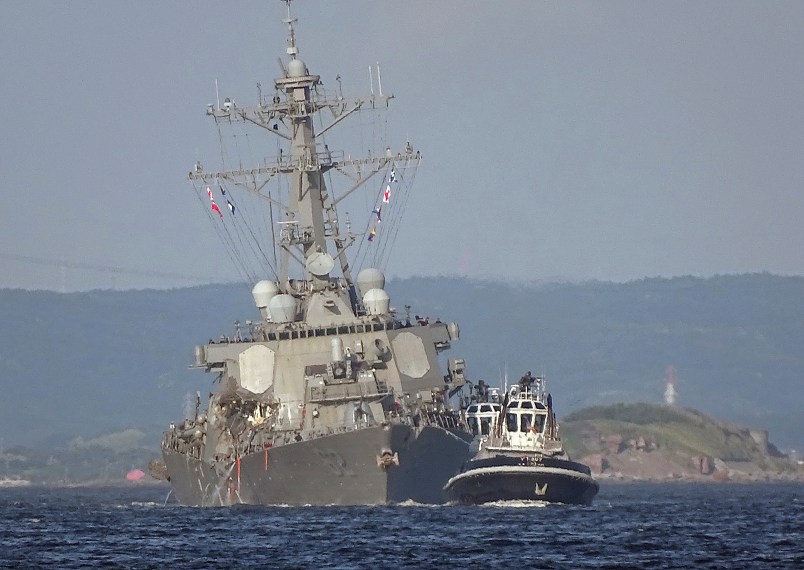 The USS Fitzgerald is seen near the U.S. Naval base in Yokosuka, southwest of Tokyo, after the U.S. destroyer collided with the Philippine-registered container ship ACX Crystal in the waters off the Izu Peninsula Saturday, June 17, 2017. Seven Navy sailors were missing and at least two, including the captain, were injured after the U.S. destroyer collided with a merchant ship off the coast of Japan before dawn Saturday, the U.S. Navy and Japanese coast guard reported. (AP Photo/Eugene Hoshiko)