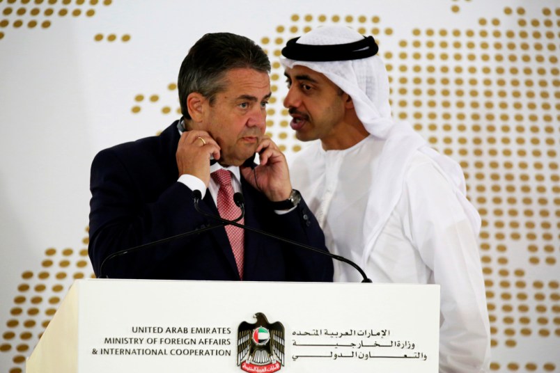 Emirati Foreign Minister Abdullah bin Zayed Al Nahyan whispers to German Foreign Minister Sigmar Gabriel during a news conference at the United Arab Emirates' Foreign Ministry in Abu Dhabi, United Arab Emirates, Tuesday, July 4, 2017. Al Nahyan met with Gabriel and talked to journalists about the ongoing diplomatic crisis engulfing Qatar. (AP Photo/Jon Gambrell)