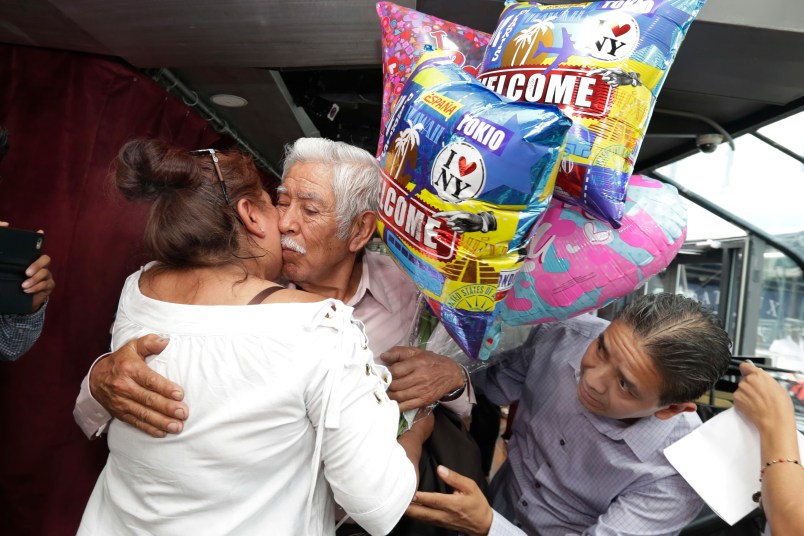 Luis Mendes Chanes, center, is reunited with his daughter Marta Mendez and her husband Luis Flores, of Queens, N.Y., aboard the Bateaux New York, in New York,  Wednesday, July 5, 2017. She had not seen him in 24 years. (AP Photo/Richard Drew)