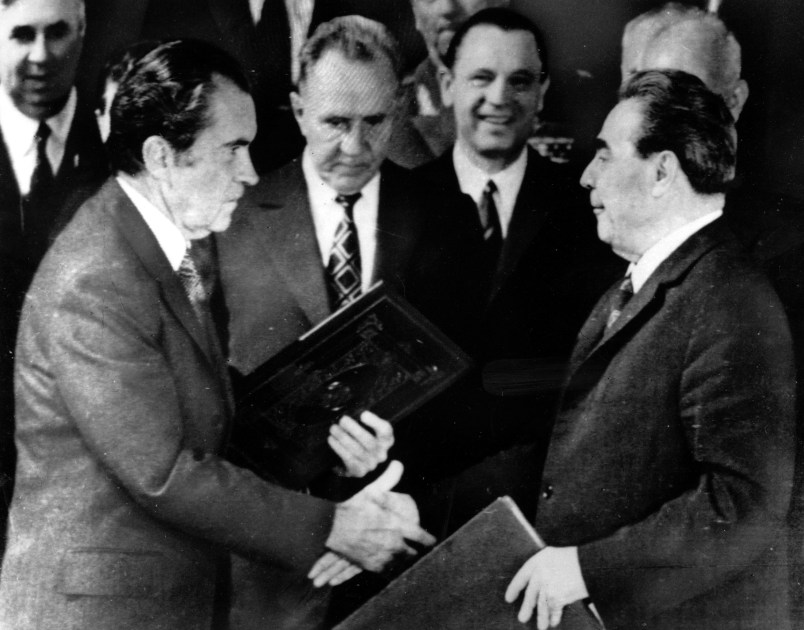 President Richard M. Nixon shakes hands with Communist Party leader Leonid Brezhnev on May 29, 1972 in Moscow after the two  signed a joint statement of long-range principles agreeing to avoid millitary confrontations and envisioning total world disarmament.  Premier Alexei Kosygin is at left center behind President Nixon's copy of the treaty.  (AP Photo/stf)