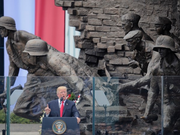 U.S. President Donald Trump delivers a speech in Krasinski Square, back dropped by the monument commemorating the 1944 Warsaw Uprising against the Nazis, in Warsaw, Poland, Thursday, July 6, 2017. (AP Photo/Alik Keplicz)