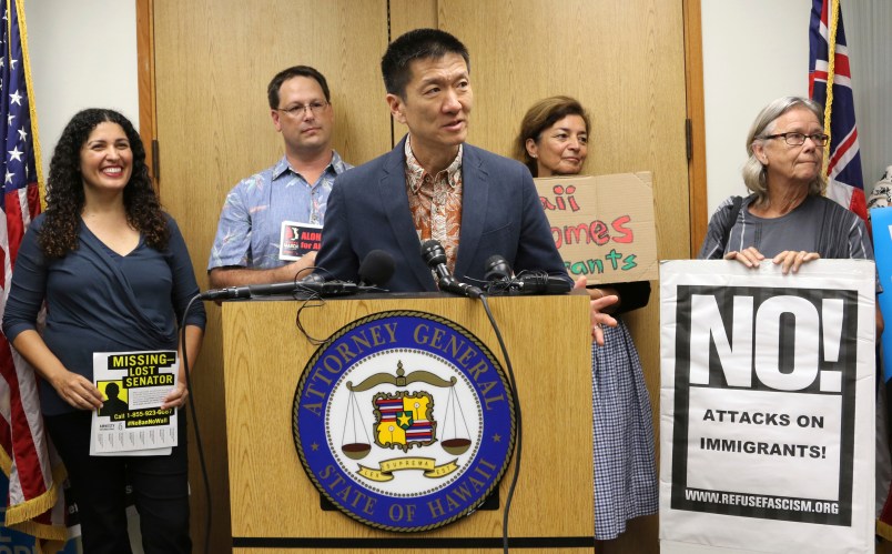 Hawaii Attorney General Douglas Chin speaks at a news conderence about President Donald Donald Trump’s travel ban, Friday, June 30, 2017 in Honolulu. Chin says the scaled-back version of Trump's travel ban has illogical standards for who should be prohibited from entering the country. Chin questioned why a stepbrother or stepsister should be allowed into the country but not a grandmother. The Trump administration set new criteria Thursday barring some citizens from six majority-Muslim countering from coming to the United States. (AP Photo/Caleb Jones)