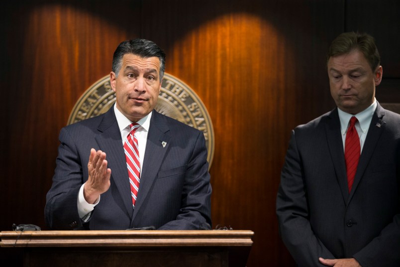 Nevada Gov. Brian Sandoval, left, and Sen. Dean Heller during a press conference where the senator announced he will vote no on the proposed GOP healthcare bill at the Grant Sawyer State Office Building on Friday, June 23, 2017 in Las Vegas. (Erik Verduzco/Las Vegas Review-Journal via AP) LOCAL TELEVISION OUT; LOCAL INTERNET OUT; LAS VEGAS SUN OUT