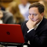 Missouri Secretary of State Jay Ashcroft looks at notes during a voter registration meeting at the the National Association of Secretaries of State conference Saturday, July 8, 2017, in Indianapolis. (AP Photo/Darron Cummings)