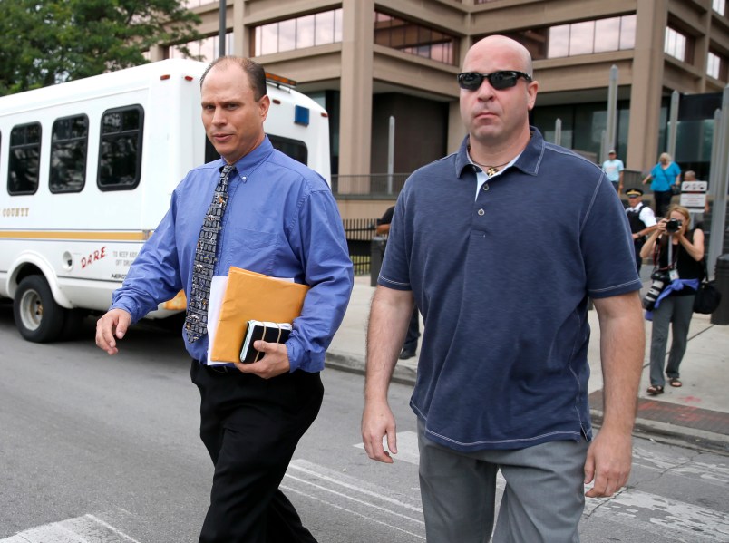 Chicago police officer Thomas Gaffney , left, and former Chicago police officer Joseph Walsh depart the Cook County Courthouse after their arraignment on state felony charges of conspiracy in the investigation of the 2014 shooting death of Laquan McDonald Monday, July 10, 2017, in Chicago. The indictment marks the latest chapter in the history of a police force dogged by allegations of racism and brutality against the city’s black residents. Both pled not guilty on all charges. (AP Photo/Charles Rex Arbogast)