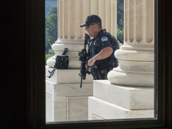 A U.S. Capitol Police officer stands his post at the entrance to the House of Representatives at the Capitol in Washington, Wednesday, June 14, 2017, after Rep. Steve Scalise, who is the majority whip, and a number of aides and Capitol Police officers were injured Wednesday morning in a shooting at a congressional baseball game in Alexandria, Va., Alexandria police say the suspect is in custody. (AP Photo/J. Scott Applewhite)