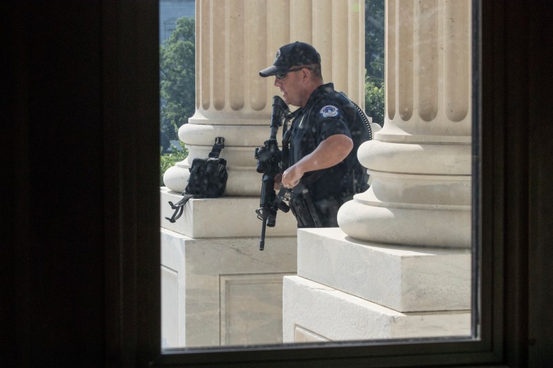 A U.S. Capitol Police officer stands his post at the entrance to the House of Representatives at the Capitol in Washington, Wednesday, June 14, 2017, after Rep. Steve Scalise, who is the majority whip, and a number of aides and Capitol Police officers were injured Wednesday morning in a shooting at a congressional baseball game in Alexandria, Va., Alexandria police say the suspect is in custody. (AP Photo/J. Scott Applewhite)