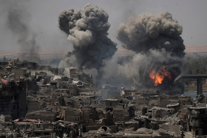 *** Alternative crop os XFD101 *** Airstrikes continue to target Islamic State positions on the edge of the Old City a day after Iraq’s prime minister declared "total victory" in Mosul, Iraq, Tuesday, July 11, 2017. (AP Photo/Felipe Dana)