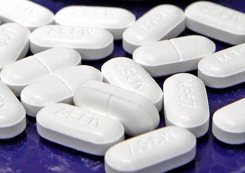 FILE - This Feb. 19, 2013 file photo shows hydrocodone-acetaminophen pills, also known as Vicodin, arranged for a photo at a pharmacy in Montpelier, Vt. A government report released Thursday, July 6, 2017, finds opioid prescription rates have been falling in recent years overall, but rising in more than 1 in 5 U.S. counties. (AP Photo/Toby Talbot, File)