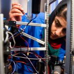 Afghanistan team member Lisa Azizi trouble shoots the teams robot entry prior to the opening ceremony for the FIRST Global Challenge 2017, in Washington, Sunday, July 16, 2017. They will be competing against entrants from more than 150 countries in the FIRST Global Challenge. It’s the first annual robotics competition designed to encourage youths to pursue careers in math and science. (AP Photo/Cliff Owen)