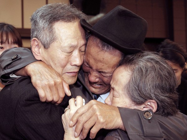 In this Oct. 22, 2015, file photo, North Korean Son Kwon Geun, center, weeps with his South Korean relatives as he bids farewell after the Separated Family Reunion Meeting at Diamond Mountain resort in North Korea. South Korea’s Red Cross said on Monday, July 17, 2017, it wants separate talks at the border village on Aug. 1 to discuss family reunions. (Korea Pool Photo via AP, File) KOREA OUT