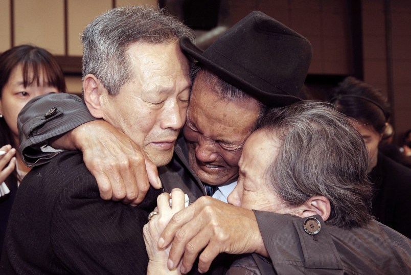 In this Oct. 22, 2015, file photo, North Korean Son Kwon Geun, center, weeps with his South Korean relatives as he bids farewell after the Separated Family Reunion Meeting at Diamond Mountain resort in North Korea. South Korea’s Red Cross said on Monday, July 17, 2017, it wants separate talks at the border village on Aug. 1 to discuss family reunions. (Korea Pool Photo via AP, File) KOREA OUT