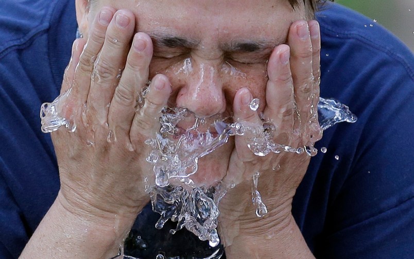 Terri Patterson cools off at a water fountain in Liberty Park Wednesday, June 21, 2017, in Salt Lake City. The National Weather Service is warning those hiking or spending time outside in southern Utah this week that temperatures could reach dangerously high levels. Very hot temperatures will continue for one more day across northern Utah. (AP Photo/Rick Bowmer)