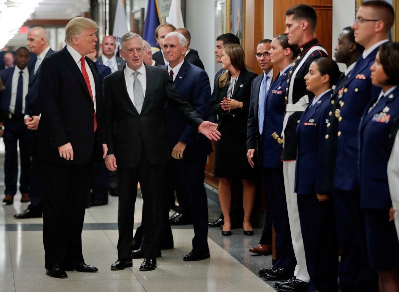 President Donald Trump and Vice President Mike Pence walk out with Defense Secretary Jim Mattis, center, to begin greeting military personnel during their visit to the Pentagon, Thursday, July 20, 2017. (AP Photo/Pablo Martinez Monsivais)