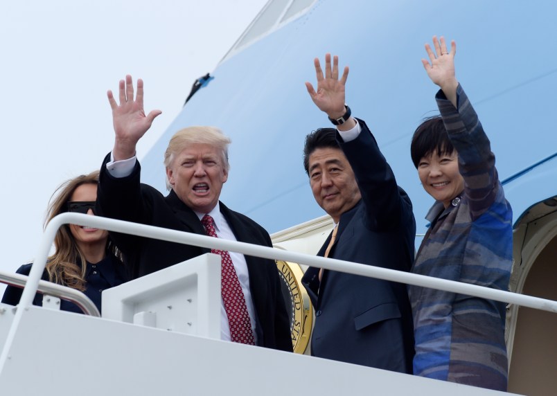 President Donald Trump and Japanese Prime Minister Shinzo Abe wave from the top of the steps of Air Force One at Andrews Air Force Base in Md., Friday, Feb. 10, 2017. Trump is hosting Abe at his estate Mar-a-Lago in Palm Beach, Fla., for the weekend. (AP Photo/Susan Walsh)Akie Abe