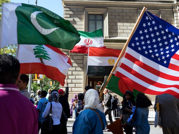 Marchers carry the national flags of Pakistan, top left, Lebanon, bottom left, Iran, top center, Egypt, bottom center and the American flag, right, during the Muslim Day Parade on Madison Ave. Sunday, Sept. 25 2016, in New York. (AP Photo/Craig Ruttle)