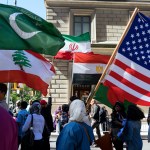 Marchers carry the national flags of Pakistan, top left, Lebanon, bottom left, Iran, top center, Egypt, bottom center and the American flag, right, during the Muslim Day Parade on Madison Ave. Sunday, Sept. 25 2016, in New York. (AP Photo/Craig Ruttle)