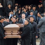 FILE - In this April 19, 2017 file photo, the casket of Justin Llivicura, 16, is carried from St. Joseph the Worker Church after Llivicura's funeral in East Patchogue, N.Y. Llivicura, 16, was one of four young men found slain in a suspected MS-13 gang killing in a park in Central Islip, N.Y., on April 12. An onslaught of gang killings on Long Island, much of it involving teenage victims, has caught the attention of President Donald Trump, who is set to visit one of the towns hit hardest by the violence.  (AP Photo/Frank Eltman, File)