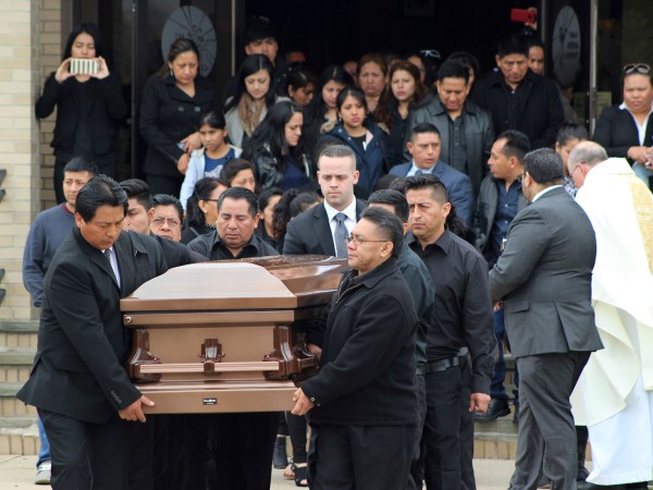 FILE - In this April 19, 2017 file photo, the casket of Justin Llivicura, 16, is carried from St. Joseph the Worker Church after Llivicura's funeral in East Patchogue, N.Y. Llivicura, 16, was one of four young men found slain in a suspected MS-13 gang killing in a park in Central Islip, N.Y., on April 12. An onslaught of gang killings on Long Island, much of it involving teenage victims, has caught the attention of President Donald Trump, who is set to visit one of the towns hit hardest by the violence.  (AP Photo/Frank Eltman, File)