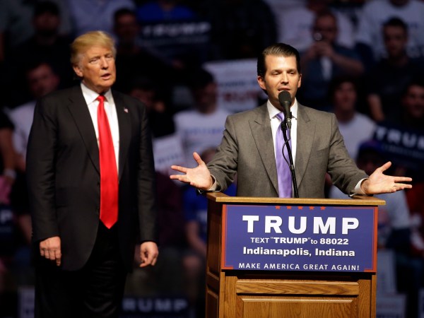 Donald Trump, Jr. speaks as Republican presidential candidate Donald Trump listens during a campaign stop Wednesday, April 27, 2016, in Indianapolis. (AP Photo/Darron Cummings)