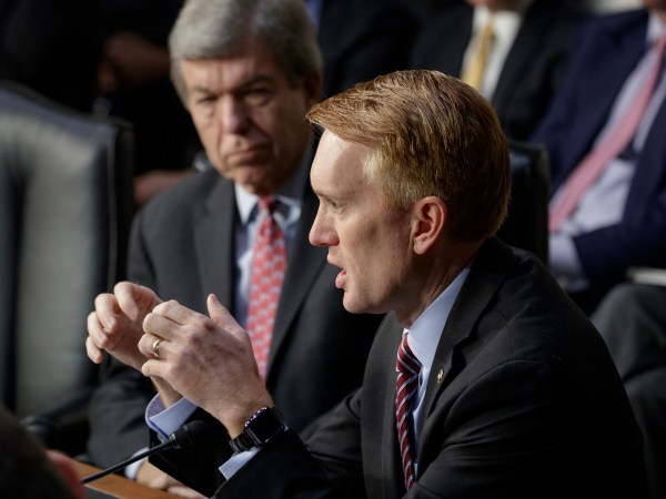 Sen. James Lankford, R-Okla., joined by Sen. Roy Blunt, R-Mo., rear, questions witnesses as the Senate Intelligence Committee conducts a hearing on Russian intervention in European elections in light of revelations by American intelligence agencies that blame Russia for meddling in the 2016 U.S. election, on Capitol Hill in Washington, Wednesday, June 28, 2017.  (AP Photo/J. Scott Applewhite)