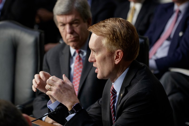 Sen. James Lankford, R-Okla., joined by Sen. Roy Blunt, R-Mo., rear, questions witnesses as the Senate Intelligence Committee conducts a hearing on Russian intervention in European elections in light of revelations by American intelligence agencies that blame Russia for meddling in the 2016 U.S. election, on Capitol Hill in Washington, Wednesday, June 28, 2017.  (AP Photo/J. Scott Applewhite)