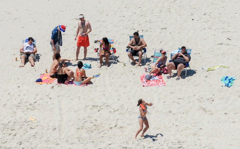 NJ Gov. Chris Christie (right) and his family enjoy a picture perfect Sunday afternoon at the beach on Island Beach State Park, which is closed to the public due to the state government shutdown.  7/2/17  (Andrew Mills | NJ Advance Media for NJ.com)