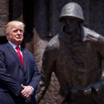 President Donald Trump listens as he is introduced to deliver a speech at Krasinski Square at the Royal Castle, Thursday, July 6, 2017, in Warsaw. (AP Photo/Evan Vucci)