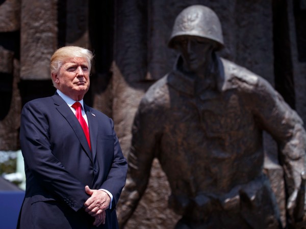 President Donald Trump listens as he is introduced to deliver a speech at Krasinski Square at the Royal Castle, Thursday, July 6, 2017, in Warsaw. (AP Photo/Evan Vucci)