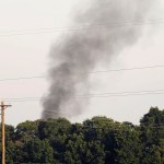 Smoke comes from the wreckage of a military refueling tanker aircraft  that crashed in a soybean field near Itta Bena, Miss., on the western edge of Leflore County, is seen from U.S. Highway 82, Monday, July 10, 2017. Authorities report at least five people were killed. (AP Photo/Andy Lo)