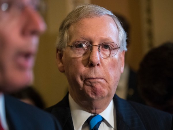Senate Majority Leader Mitch McConnell, R-Ky., listens to remarks by Sen. John Barrasso, R-Wyo., as they meet with reporters after a closed-door Republican strategy session, on Capitol Hill in Washington, Tuesday, July 11, 2017. McConnell says Senate Republicans will unveil their revised health care bill Thursday and begin voting on it next week, adding, he could delay the chamber's August recess for two weeks as the GOP tries breaking logjams that have slowed work on that and other issues.   (AP Photo/J. Scott Applewhite)