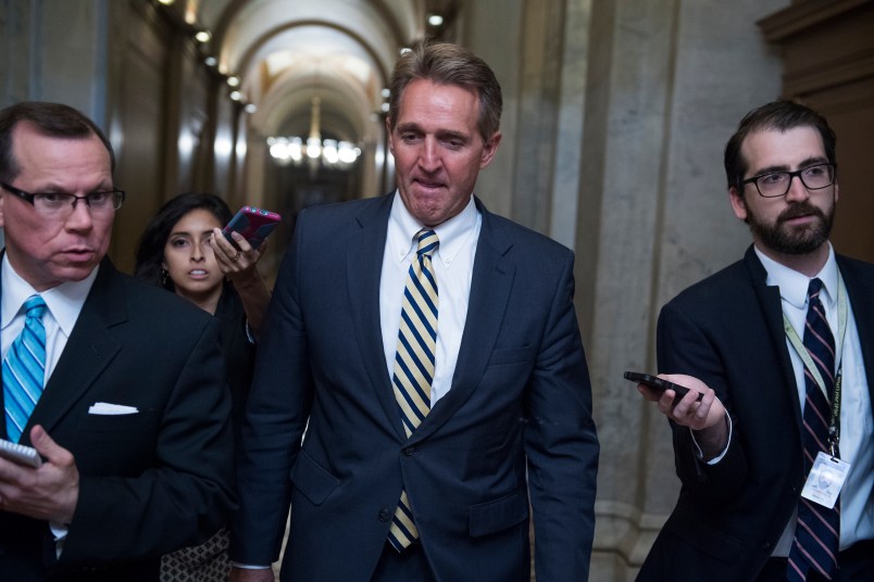 UNITED STATES - JULY 13: Sen. Jeff Flake, R-Ariz., talks with reporters in the Capitol after a meeting where Senate Republicans' unveiled and updated health care bill on July 13, 2017. (Photo By Tom Williams/CQ Roll Call)