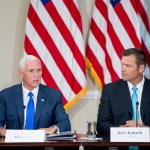 Vice President Mike Pence, left, accompanied by Vice-Char Kansas Secretary of State Kris Kobach, right, speaks during the first meeting of the Presidential Advisory Commission on Election Integrity at the Eisenhower Executive Office Building on the White House complex in Washington, Wednesday, July 19, 2017. (AP Photo/Andrew Harnik)