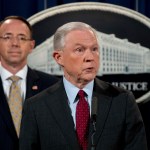 Attorney General Jeff Sessions accompanied by Deputy Attorney General Rod Rosenstein, left, speaks at a news conference to announce an international cybercrime enforcement action at the Department of Justice, Thursday, July 20, 2017, in Washington. (AP Photo/Andrew Harnik)