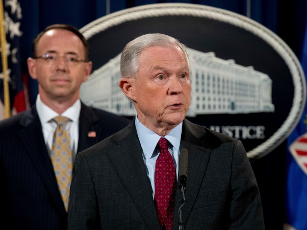 Attorney General Jeff Sessions accompanied by Deputy Attorney General Rod Rosenstein, left, speaks at a news conference to announce an international cybercrime enforcement action at the Department of Justice, Thursday, July 20, 2017, in Washington. (AP Photo/Andrew Harnik)