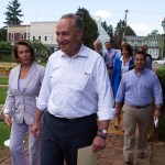 Senate Minority Leader Chuck Schumer of N.Y. and House Minority Leader Nancy Pelosi of Calif. lead Congressional Democrats to a news conference to unveil their new agenda, Monday, July 24, 2017, in Berryville, Va. House and Senate Democrats are offering a retooled message and populist agenda, promising to working Americans "someone has your back."  (AP Photo/Cliff Owen)
