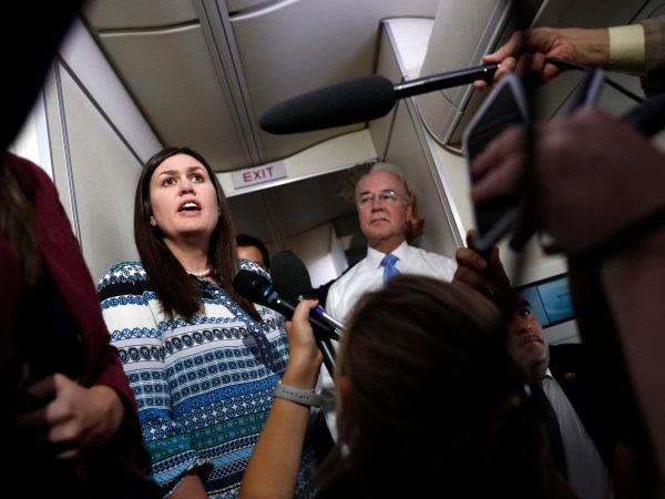 White House press secretary Sarah Huckabee Sanders, joined by Secretary of Health and Human Services Tom Price, speaks to media aboard Air Force One, Monday, July 24, 2017, in Andrews Air Force Base, Md., en route to the 2017 National Scout Jamboree in Glen Jean, W.Va. (AP Photo/Carolyn Kaster)