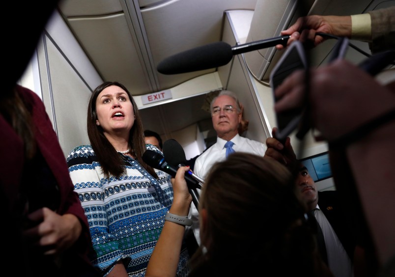 White House press secretary Sarah Huckabee Sanders, joined by Secretary of Health and Human Services Tom Price, speaks to media aboard Air Force One, Monday, July 24, 2017, in Andrews Air Force Base, Md., en route to the 2017 National Scout Jamboree in Glen Jean, W.Va. (AP Photo/Carolyn Kaster)