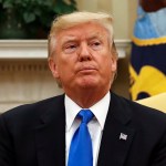 President Donald Trump looks at members of the media extra the Oval Office of the White House in Washington, during his meeting with Lebanese Prime Minister Saad Hariri, Tuesday, 25, 2017. (AP Photo/Pablo Martinez Monsivais)