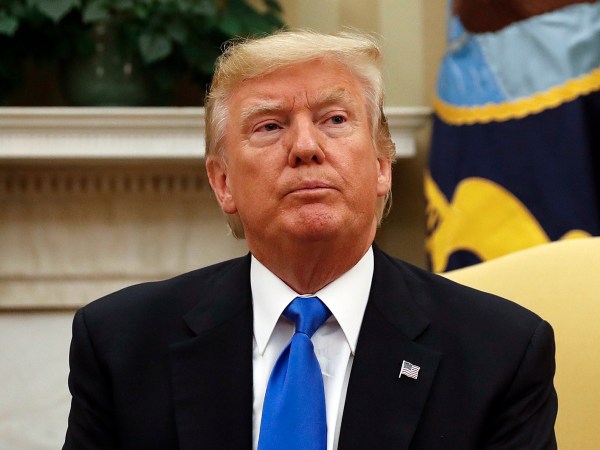 President Donald Trump looks at members of the media extra the Oval Office of the White House in Washington, during his meeting with Lebanese Prime Minister Saad Hariri, Tuesday, 25, 2017. (AP Photo/Pablo Martinez Monsivais)